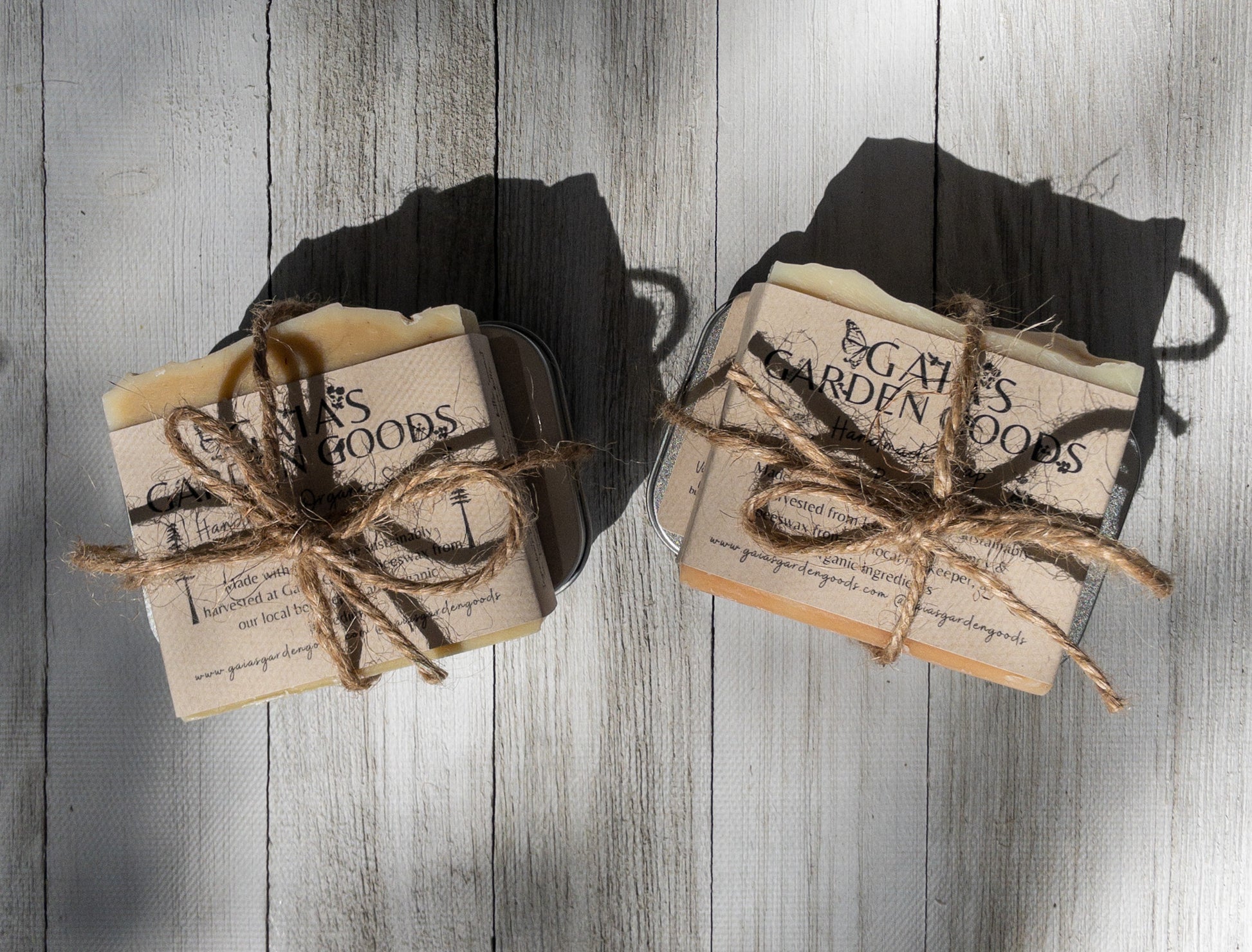 Two soap and lotion sets wrapped in a bow with twine.  Each set contains one soap and one lotion of the same scent.