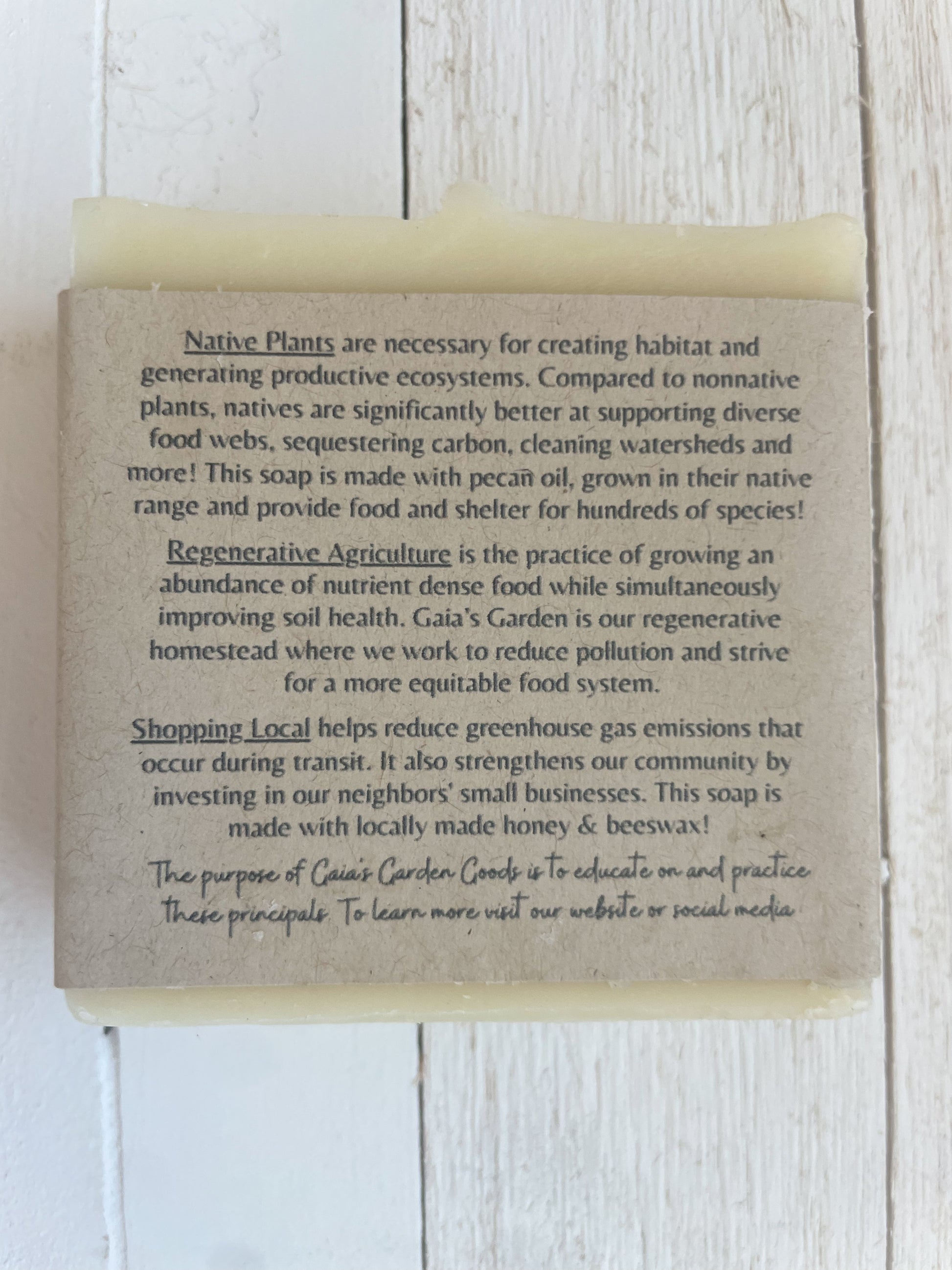 The back of the soap label. It highlights three pillars of Gaia's Garden Goods: Native Plants, Regenerative Agriculture, and Shopping local. Every soap embodies these principals through their ingredients and sourcing.